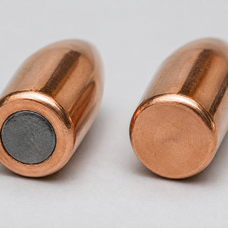The exposed lead core of an FMJ and the enclosed copper base of a TMJ, showing the differences between TMJ and FMJ bullets.