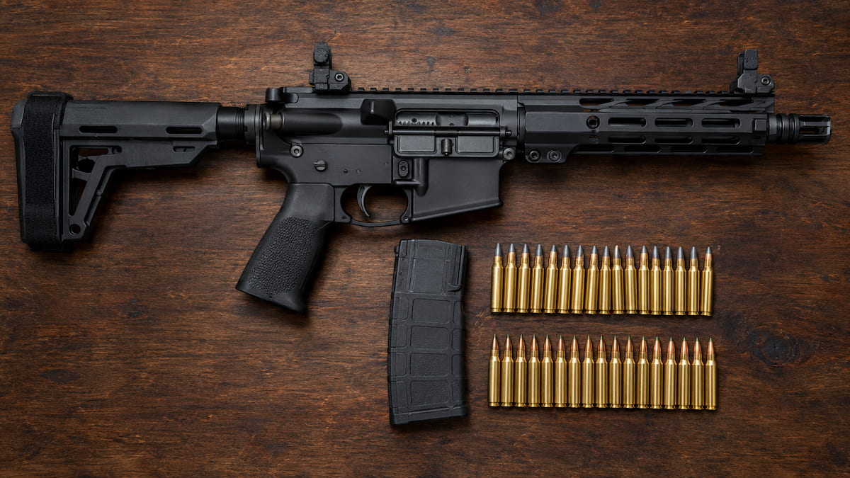 AR-15 SBR with 5.56 cartridges on a workbench, showing the best ammo for 10.5 barrels for top performance.